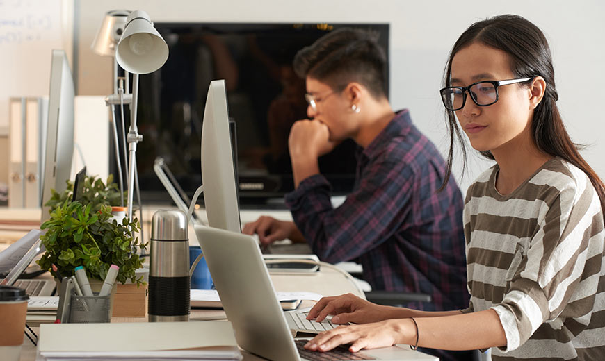Two people working in the office.